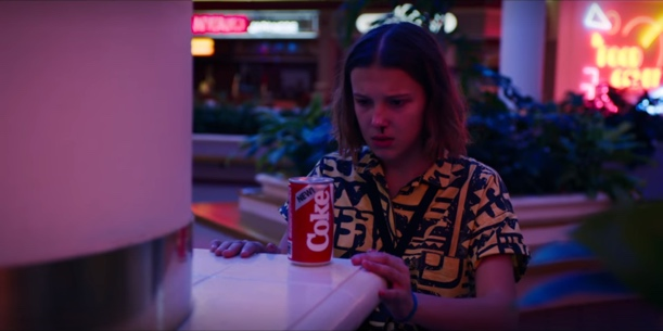 A still from the Netflix series Stranger Things in which a Coca-Cola can is prominently shown.