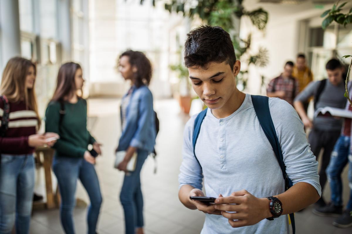 Photo of a teen using their cell phone