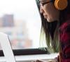 Image of a teen looking at a laptop