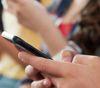 Hands holding a cell phone